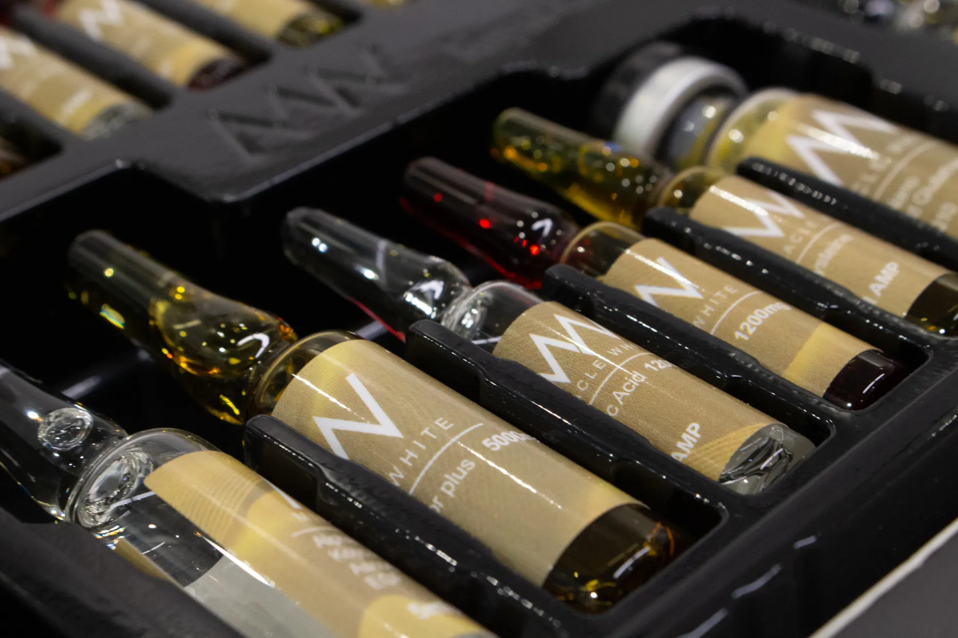 Close detail of Miracle White ampoules seated in the moulded tray