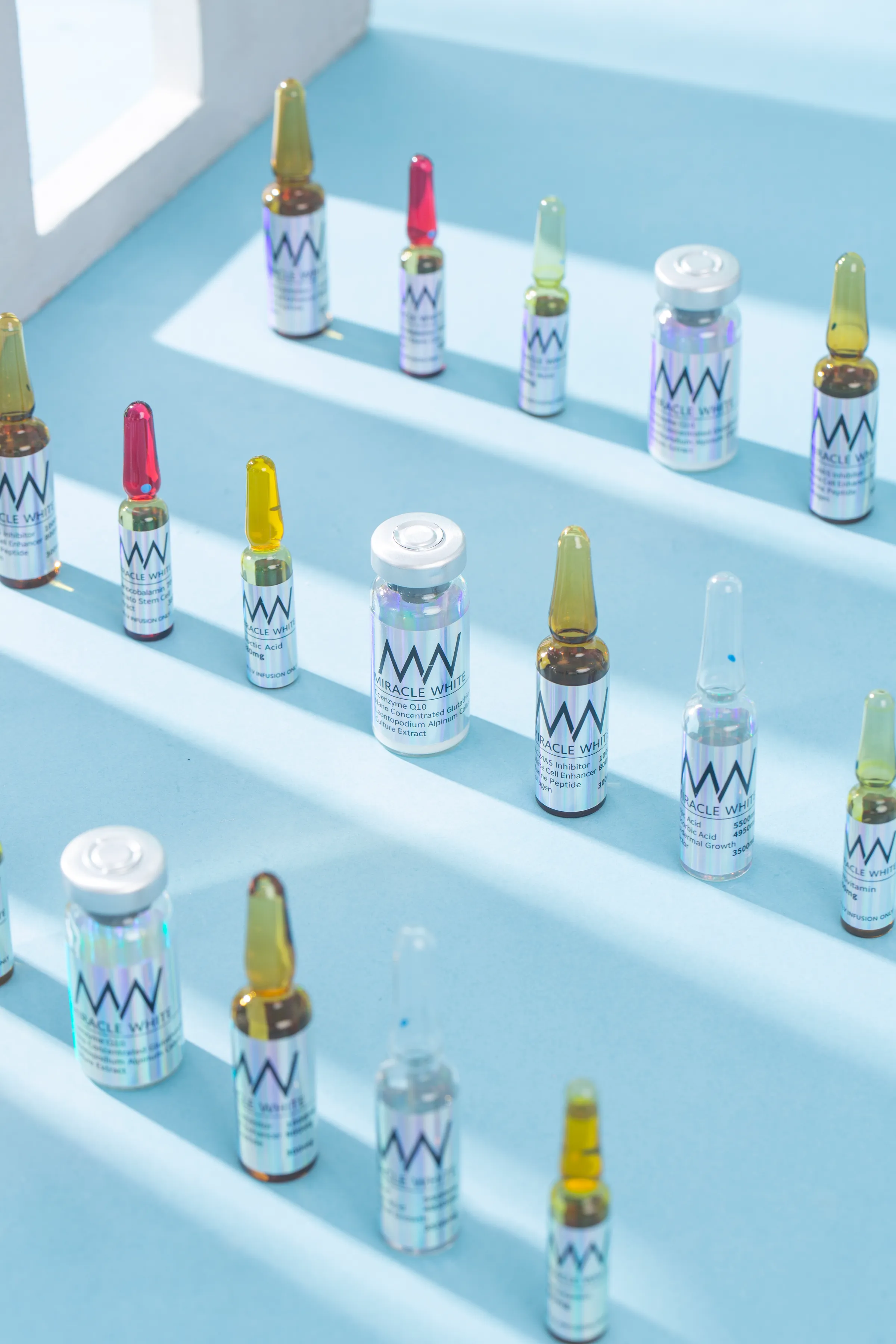Miracle White ampoules and vials arranged on tiered steps